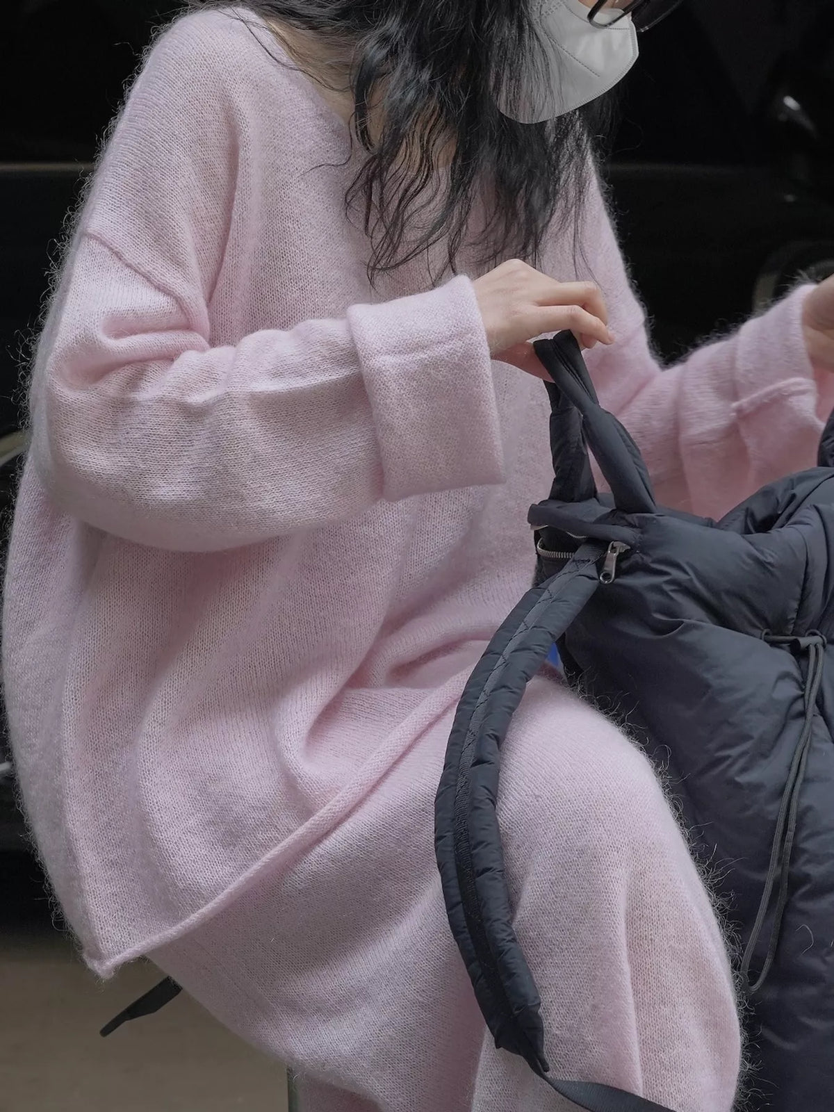 Pink round neck sweater, side view
