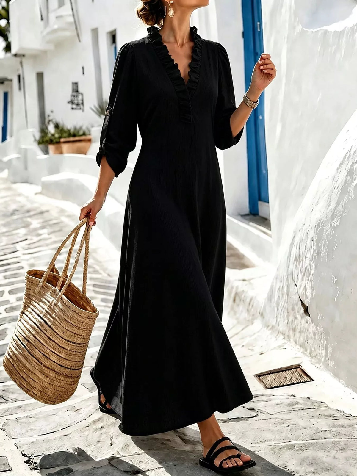 Black V-neck maxi dress, front outdoor view