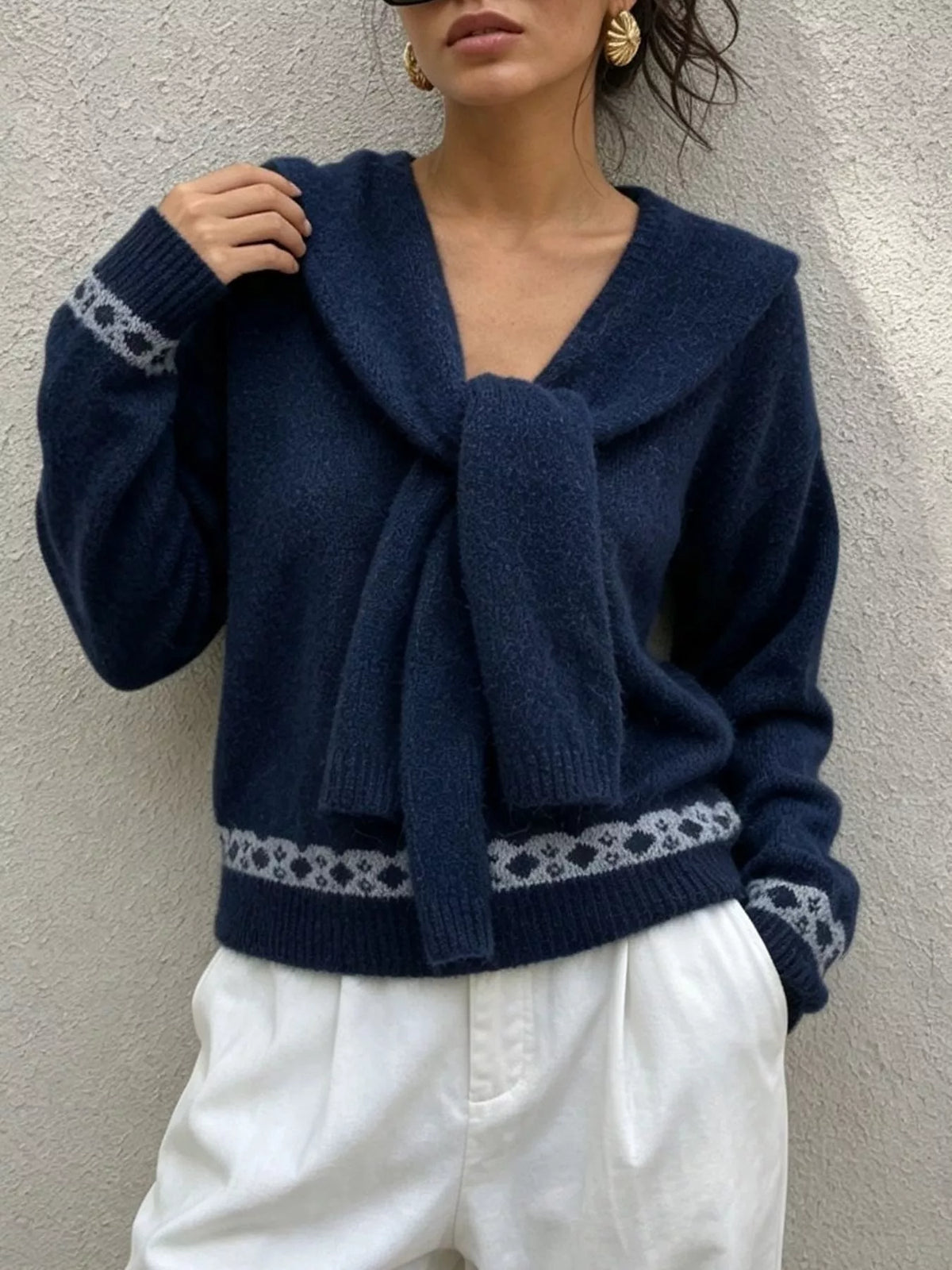 Navy scarf-detail dropped-shoulder sweater, scarf and cuff detail.