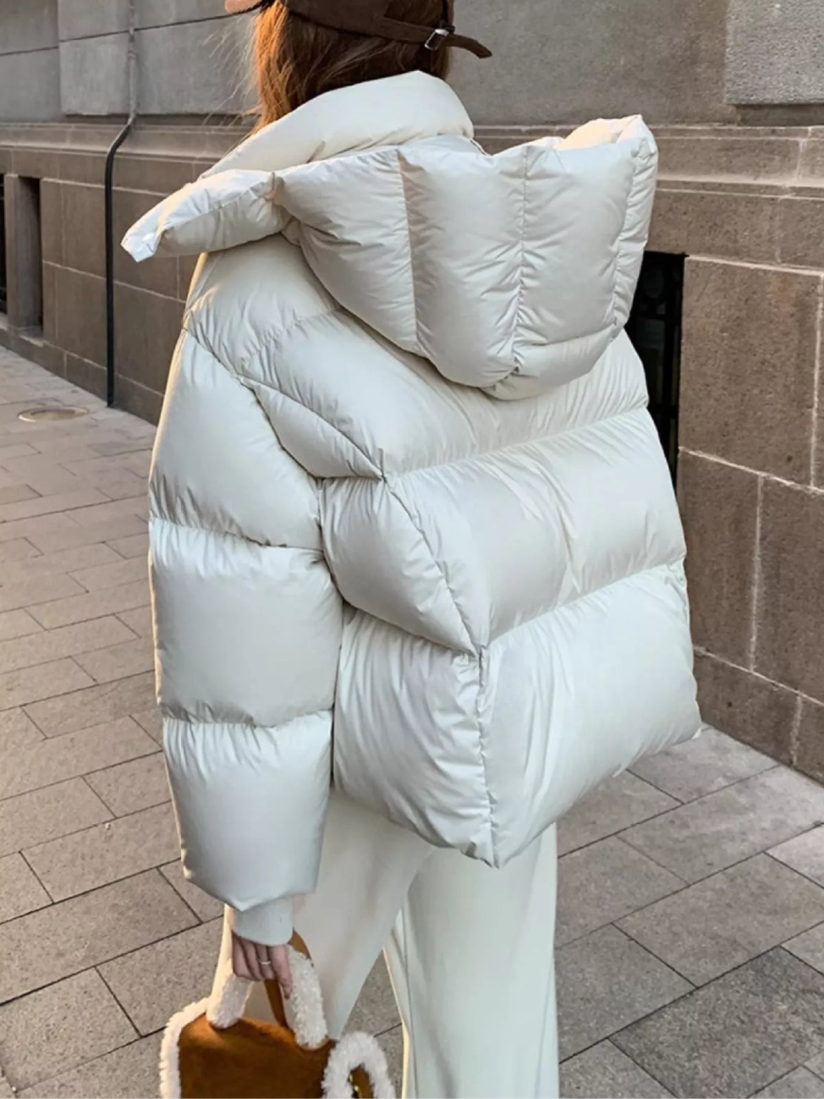 Cream quilted hooded puffer jacket, back view