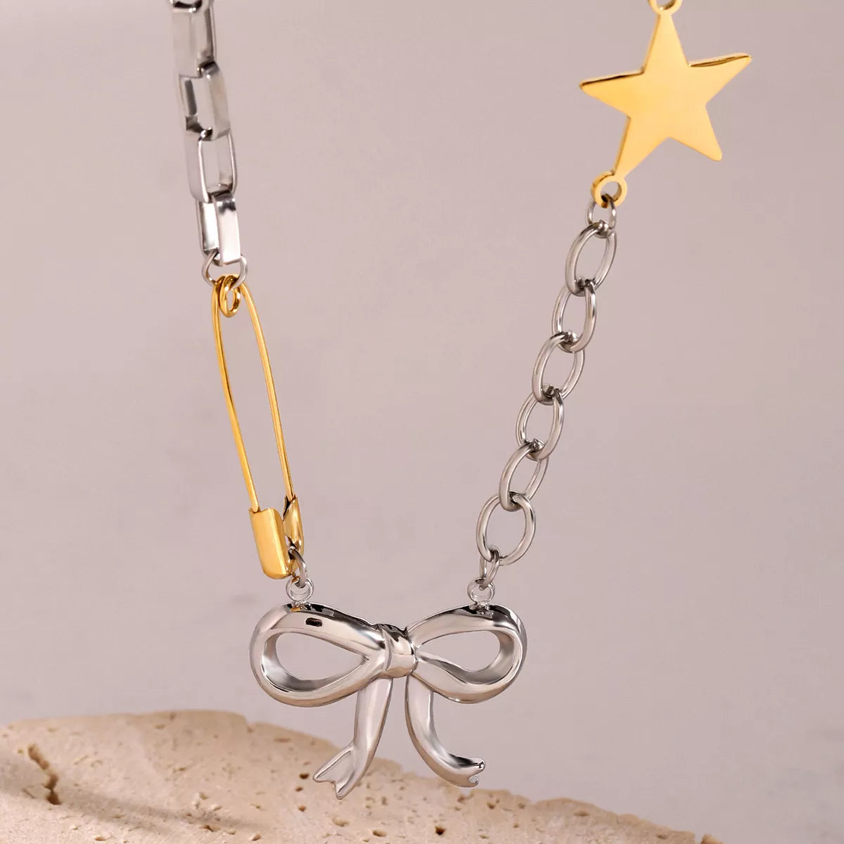 Trendsi Two-Tone Bow Star Necklace -