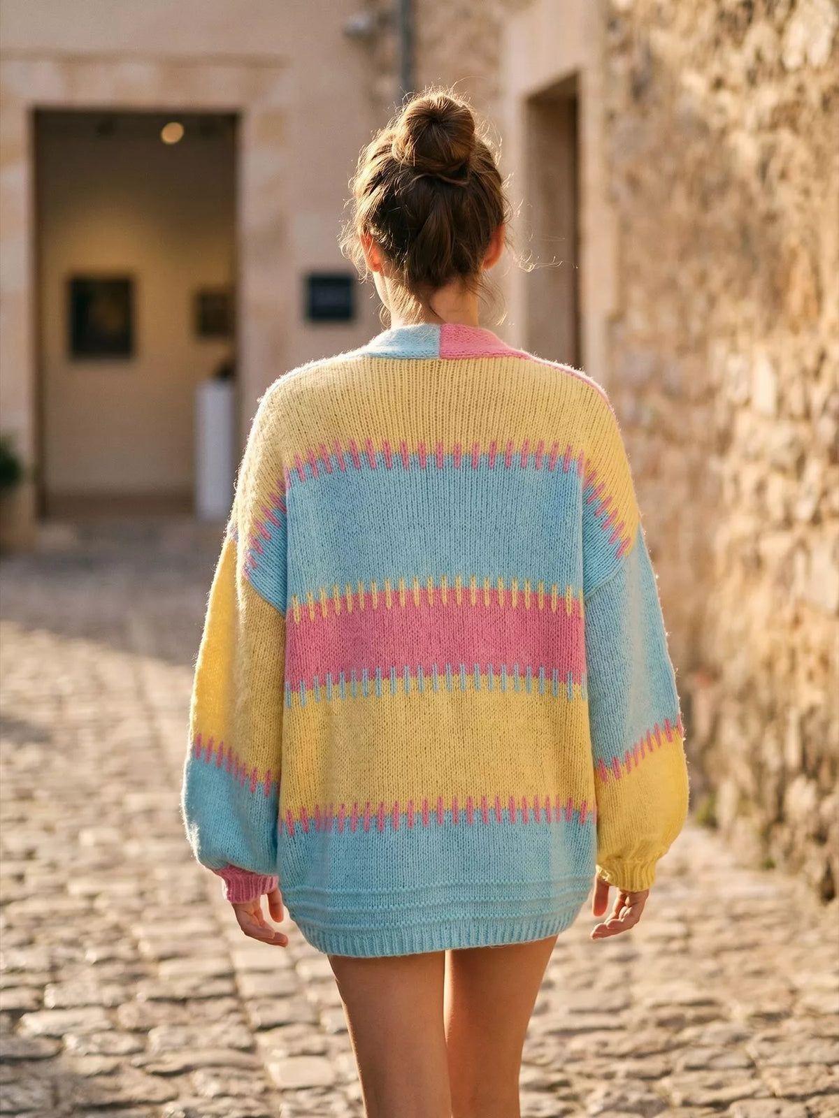 Pastel multicolor color-block v-neck cardigan, back view.