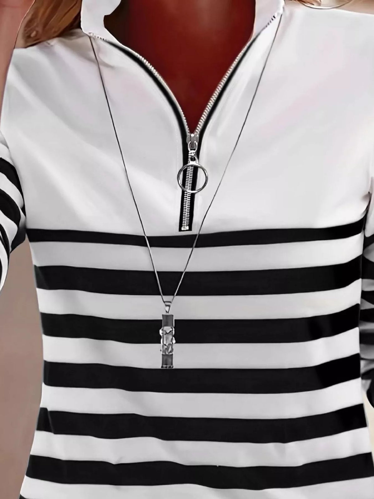 Black and white quarter-zip striped top, neckline detail