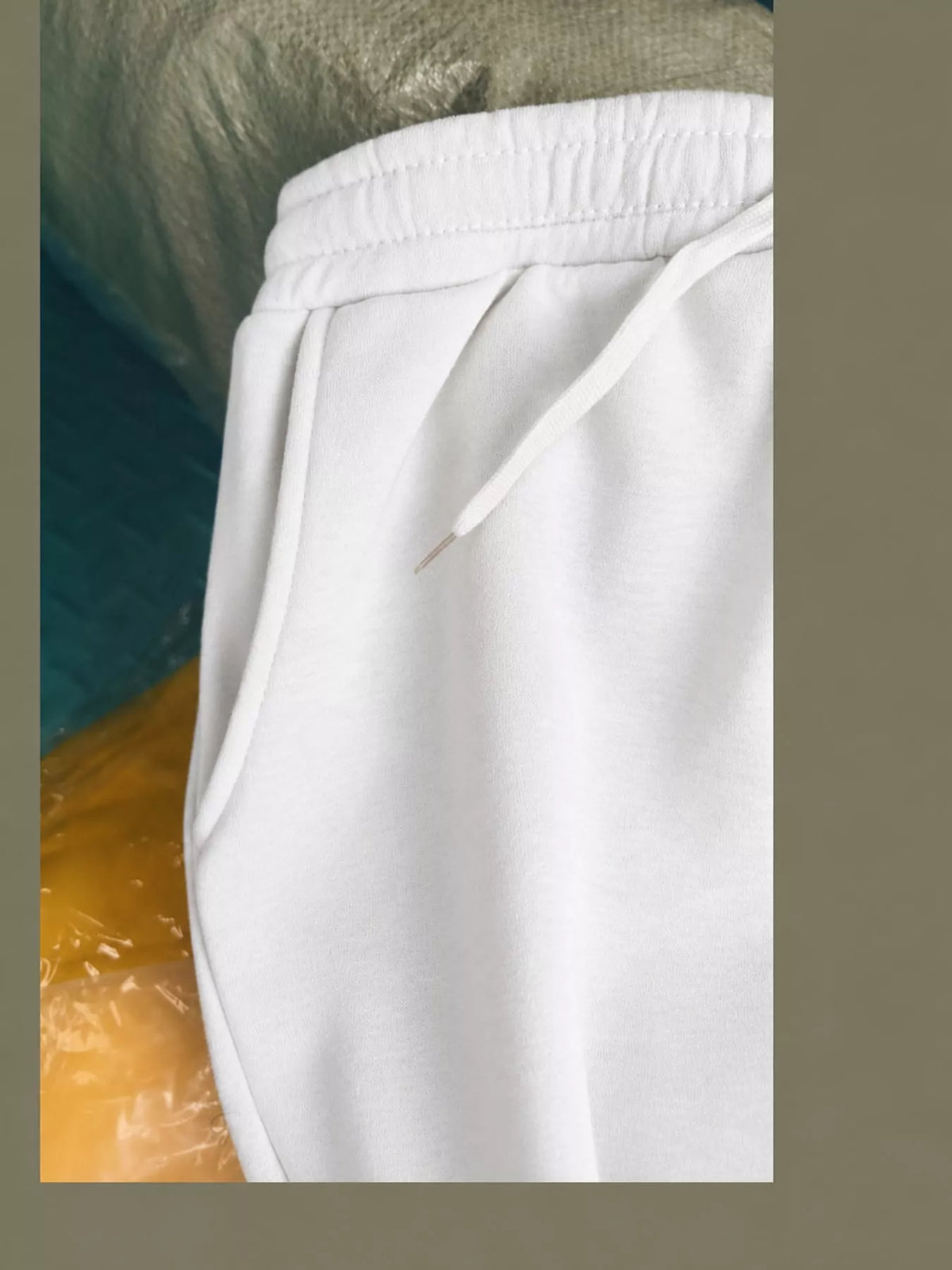 Light gray wide-leg pants with drawstring, detail view