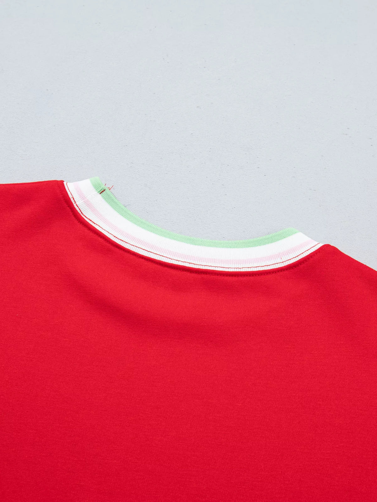Red sweatshirt with contrast striped ribbed trim, back neckline detail