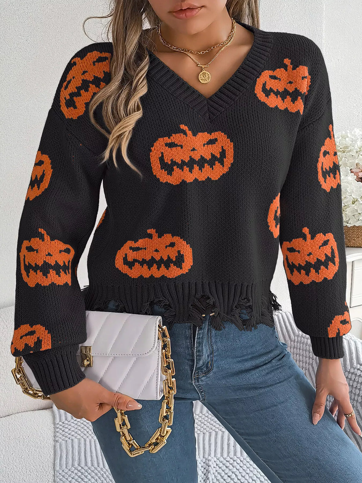 Pumpkin Distressed Hem Sweater in black, front view