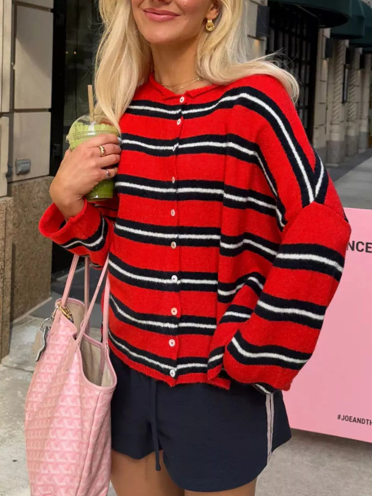 Red and black striped button-front cardigan, side view