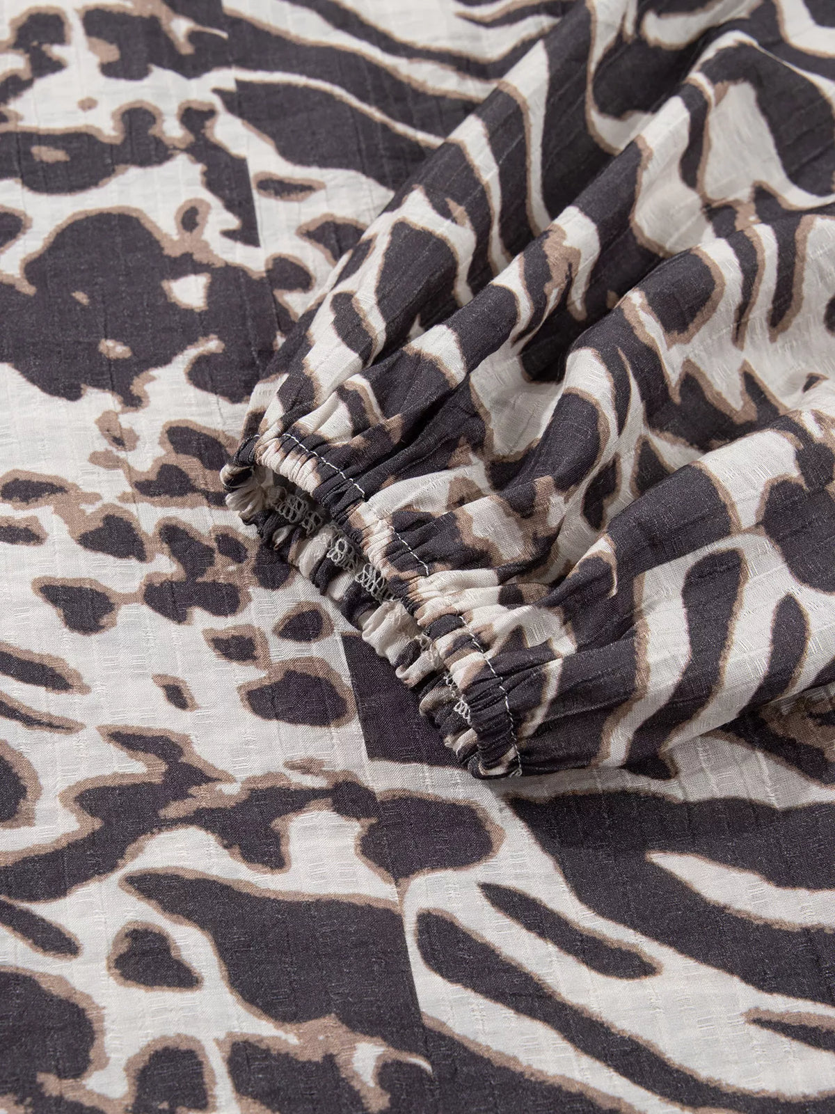 Leopard Print V Neck Button Down Balloon Sleeve Shirt in dark brown, construction detail
