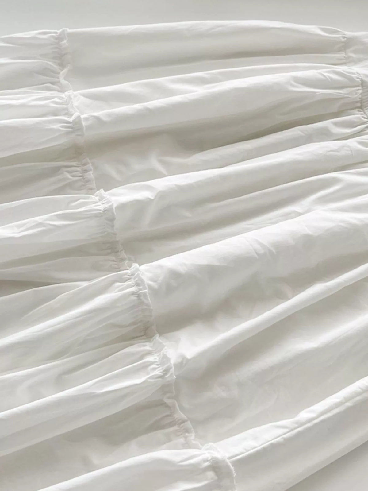 Women's Ruffled Square Neck Tiered Maxi Dress in white — skirt detail view