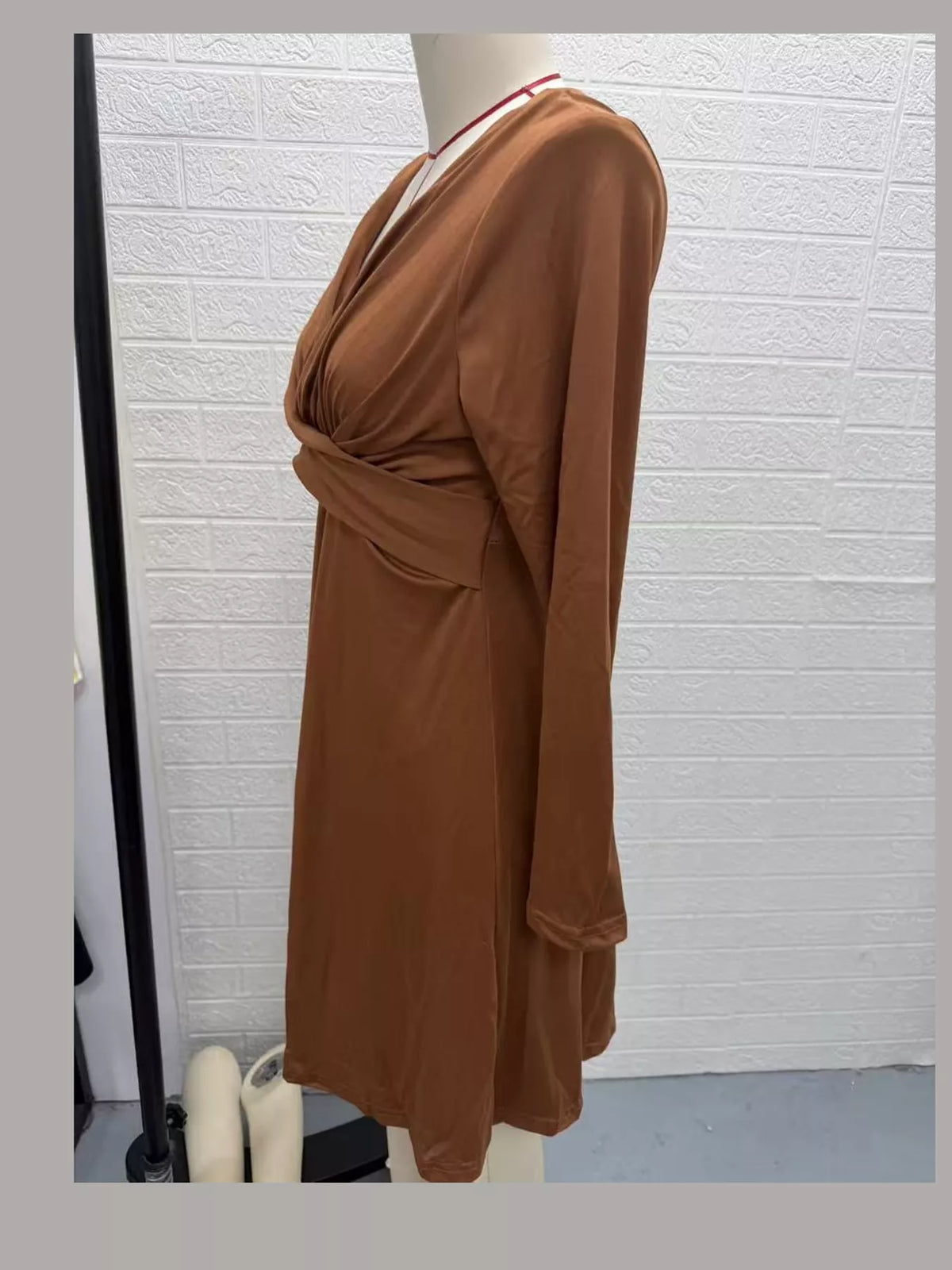Brown long sleeve ruched-front midi dress, side view