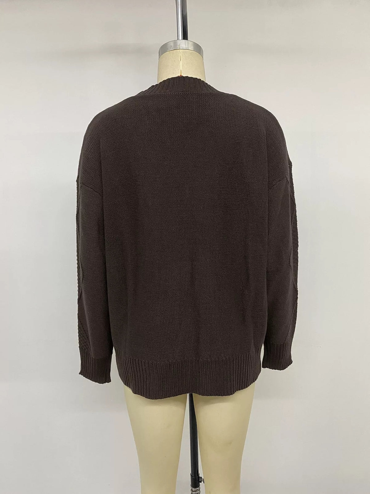 Brown V-neck cable knit cardigan, back on mannequin