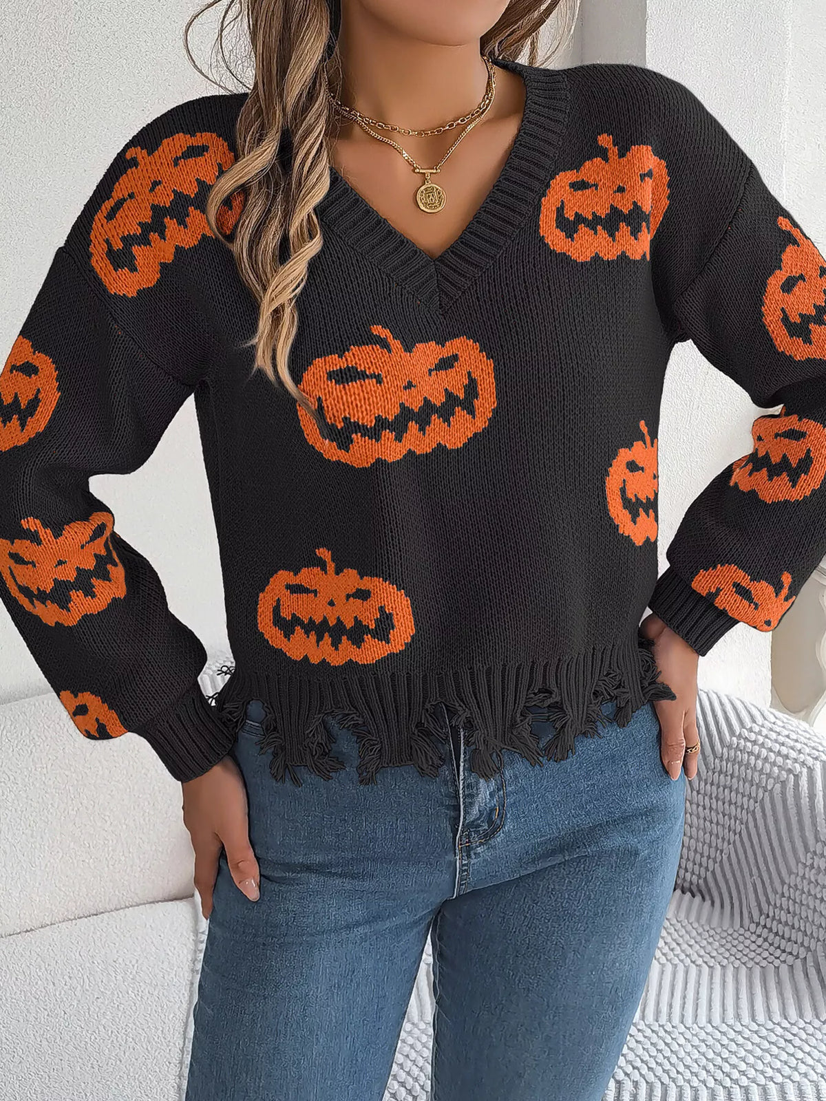 Pumpkin Distressed Hem Sweater in black, front view