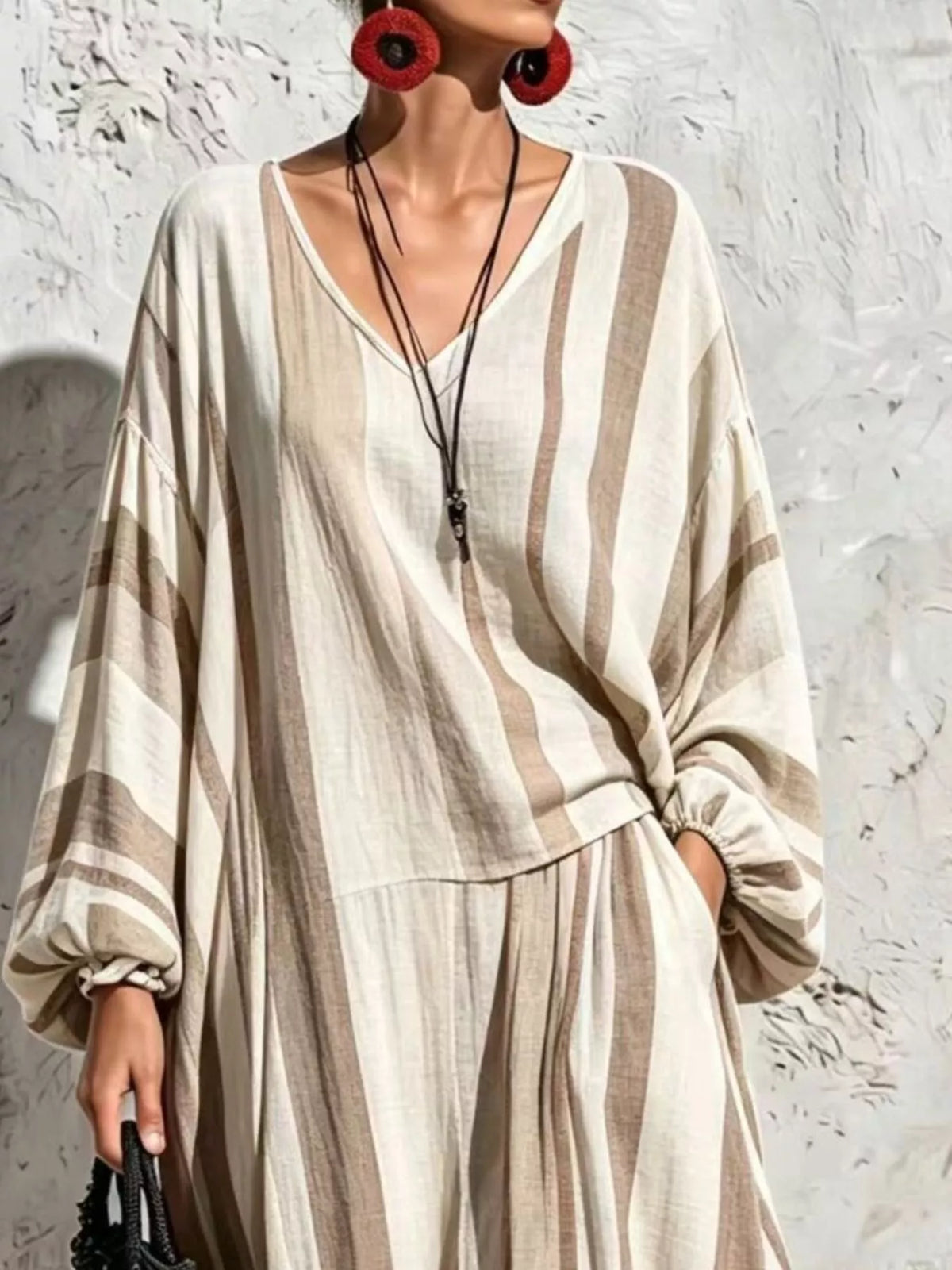 Cream and taupe striped v-neck top and wide-leg pants set, top and neckline detail.