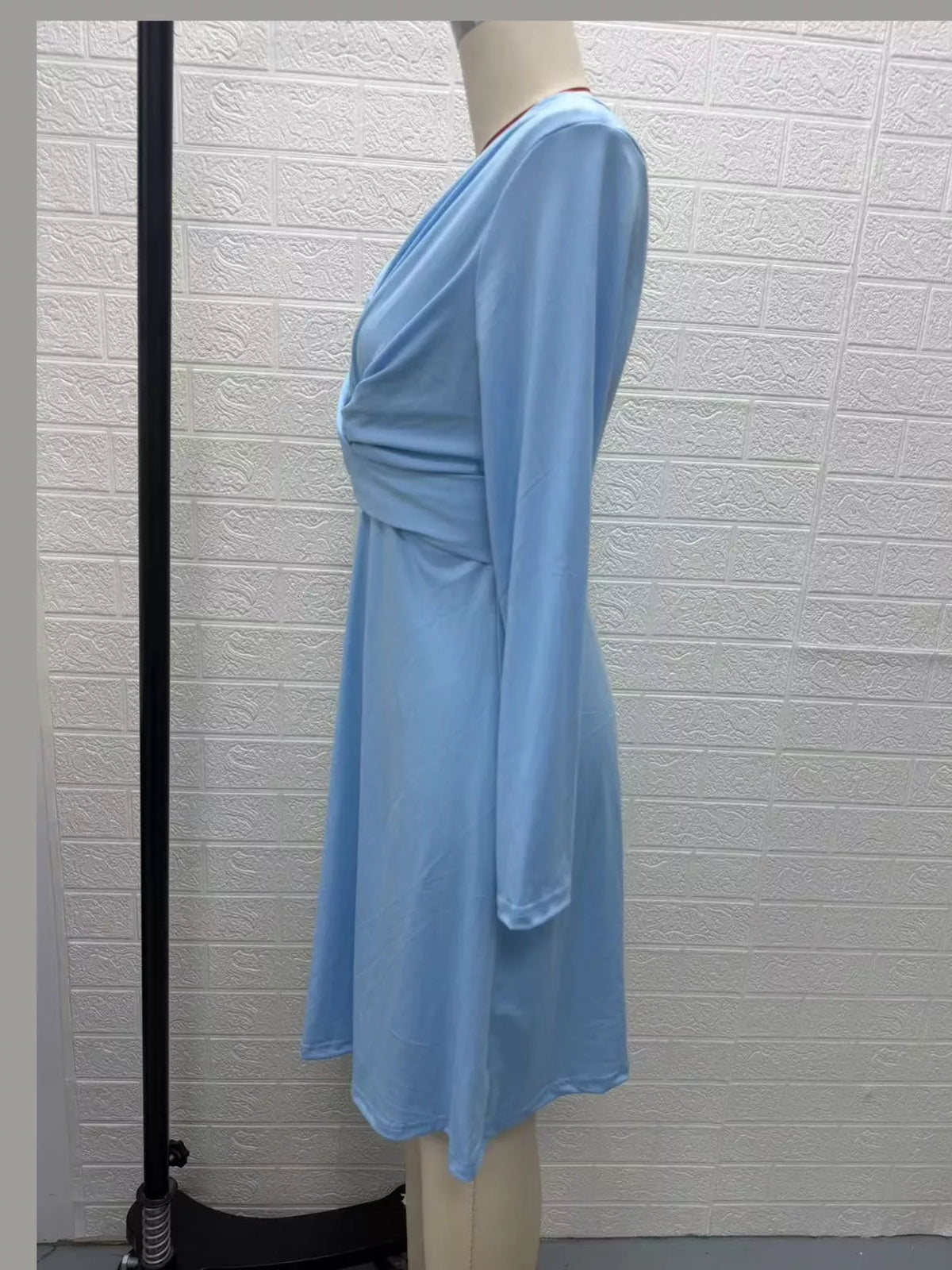 Light blue long sleeve ruched-front midi dress, side view