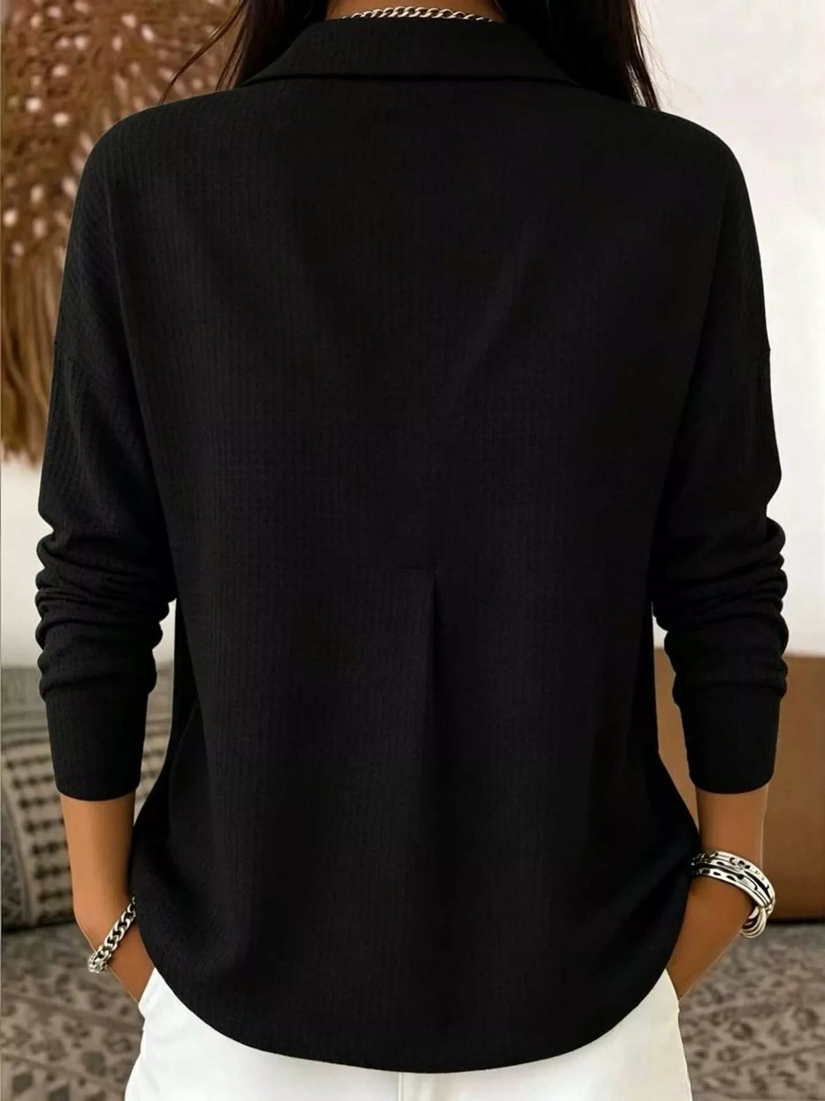 Black waffle knit snap-front blouse, back view
