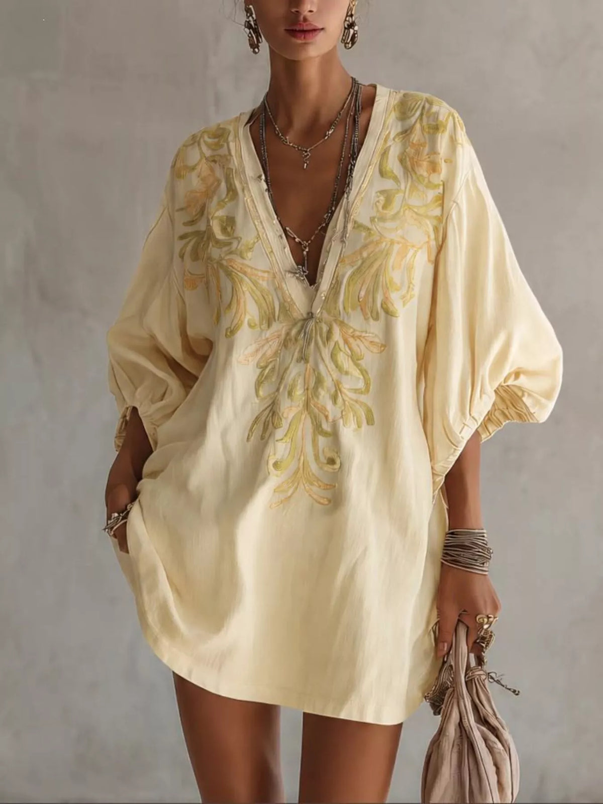 Pastel yellow embroidered v-neck mini dress