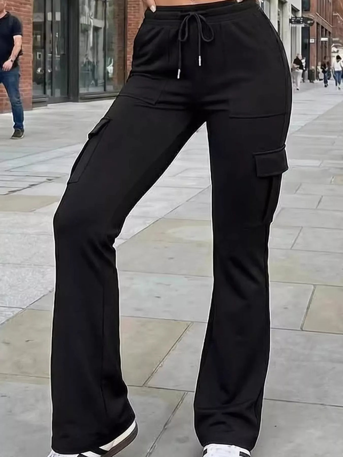 Black high-waisted slim-fit cargo flare pants with drawstring