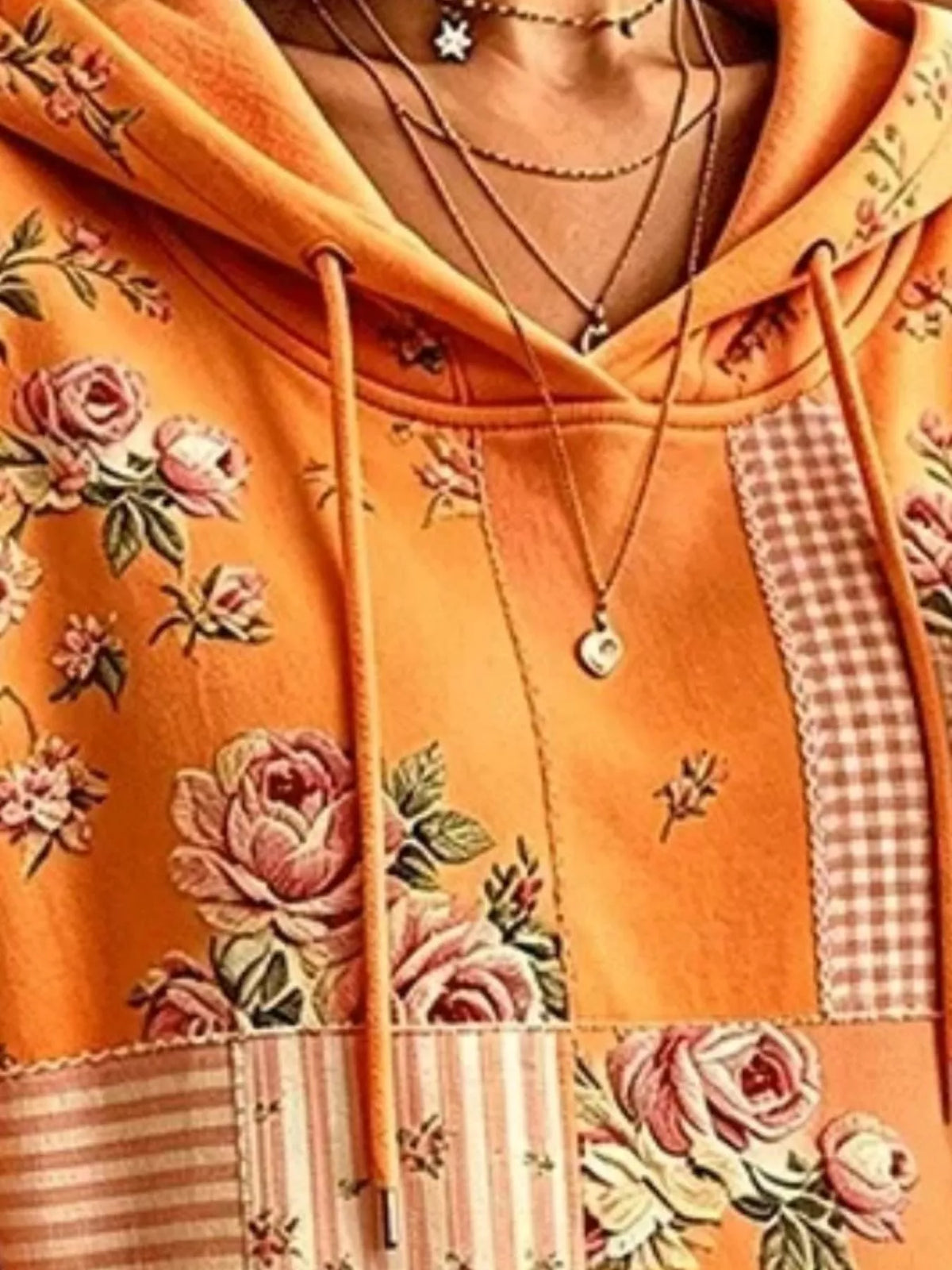 Orange floral drawstring dropped-shoulder hoodie, hood and drawstring detail.