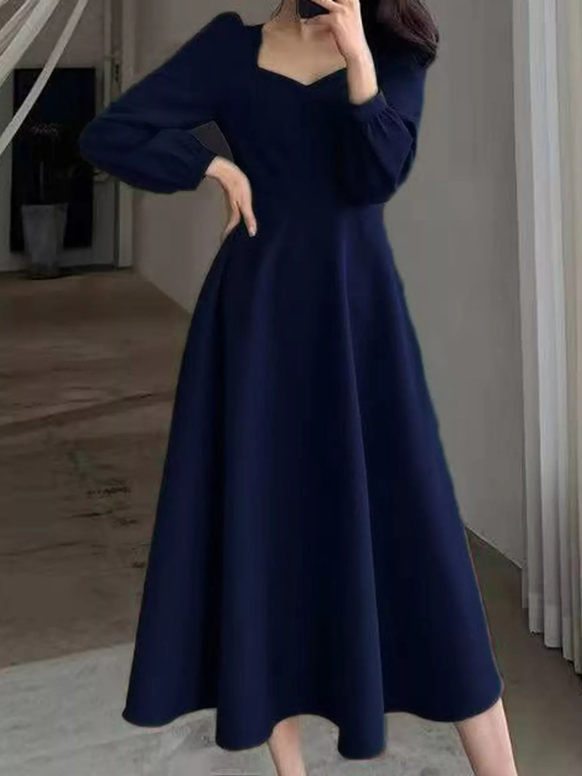 Navy long sleeve a line midi dress, front view