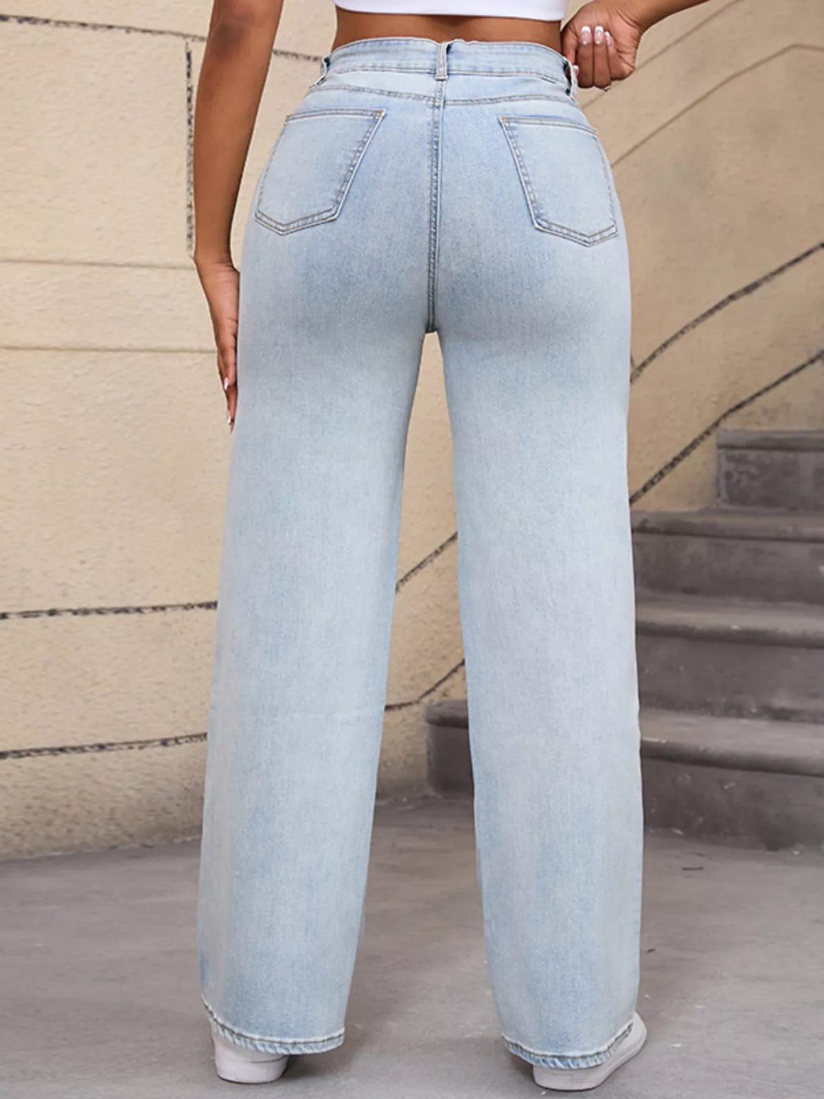 Light blue distressed wide-leg jeans, back view