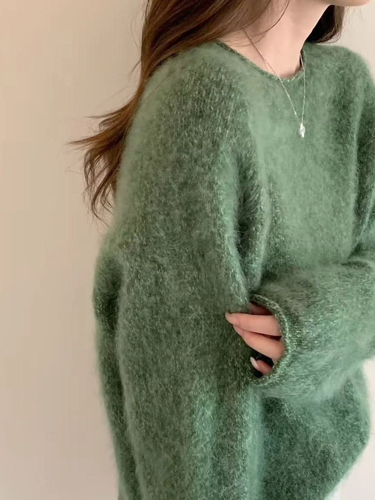 Round neck long sleeve sweater, side view