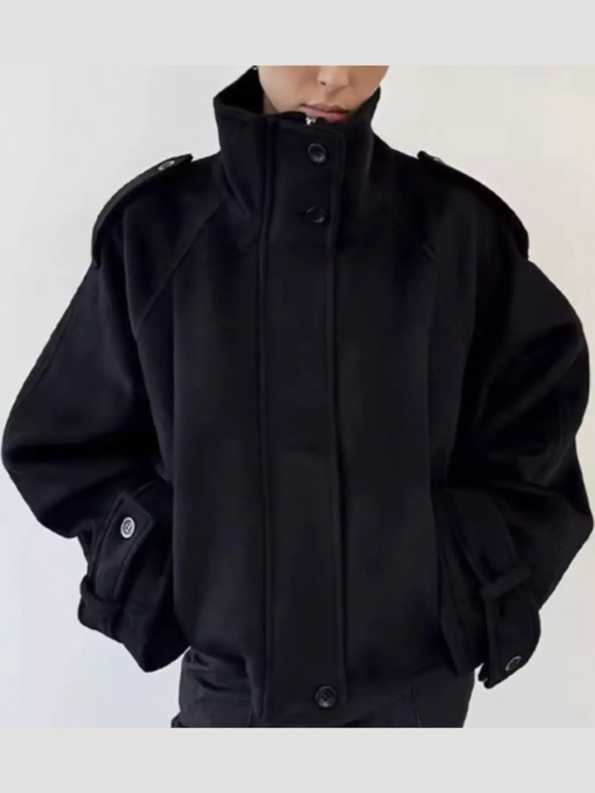 Black zip-up stand-collar jacket — front view