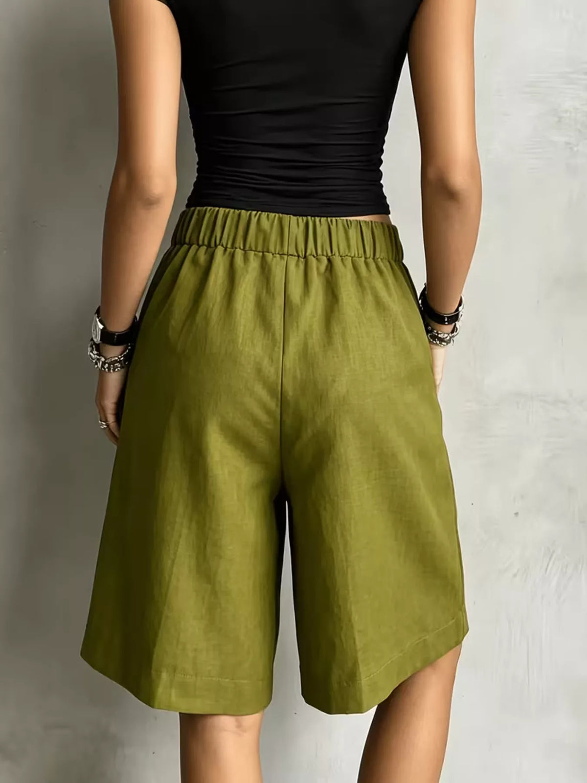 Olive green drawstring shorts, back view