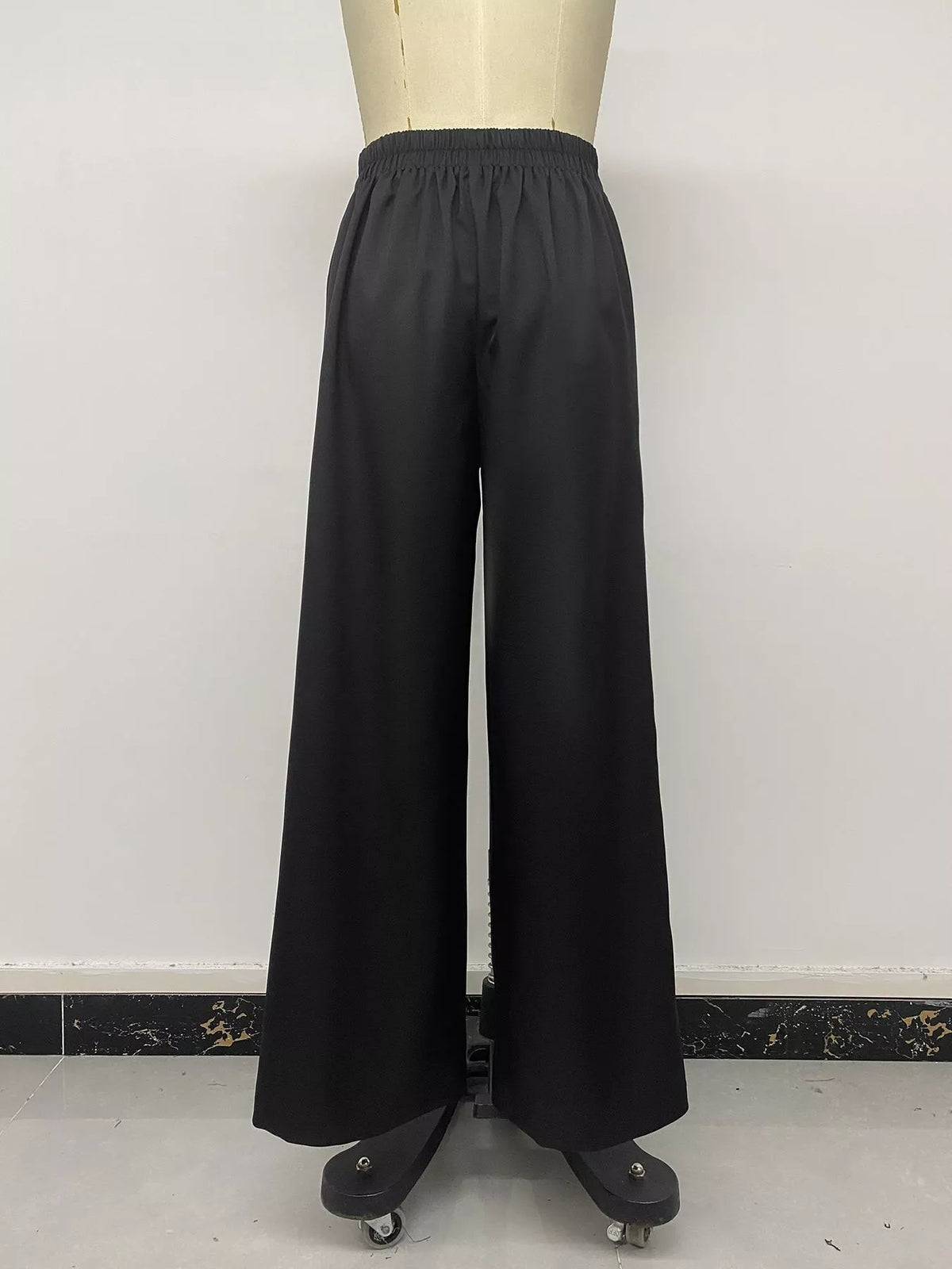 Black wide-leg pants with overlap front, back on mannequin