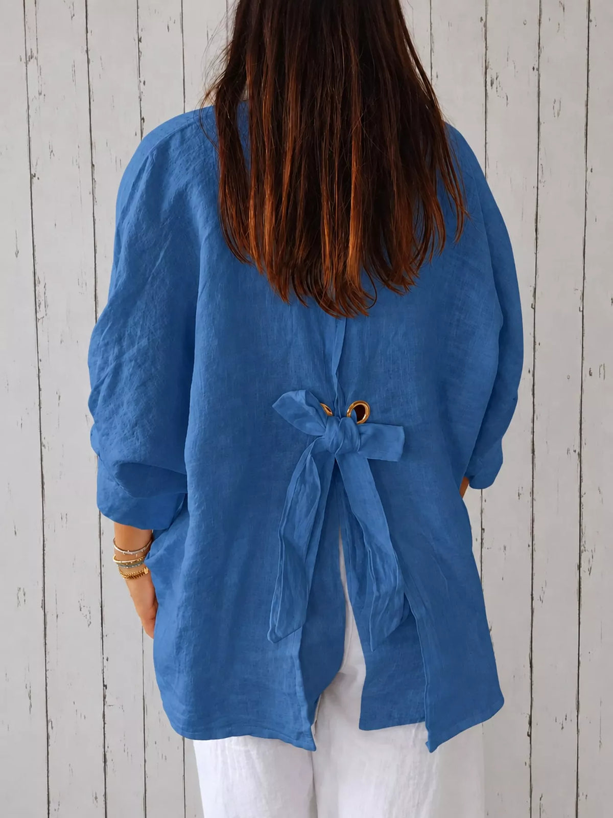Blue loose fit tie back shirt, back view