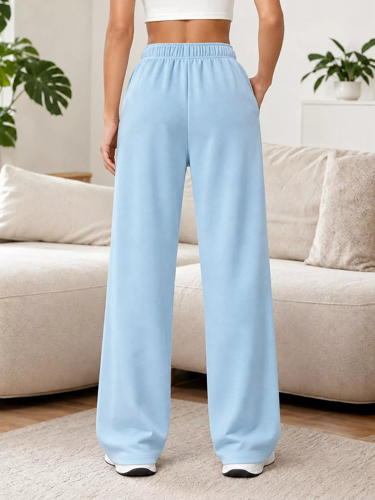 Light blue wide-leg pants with drawstring, back view