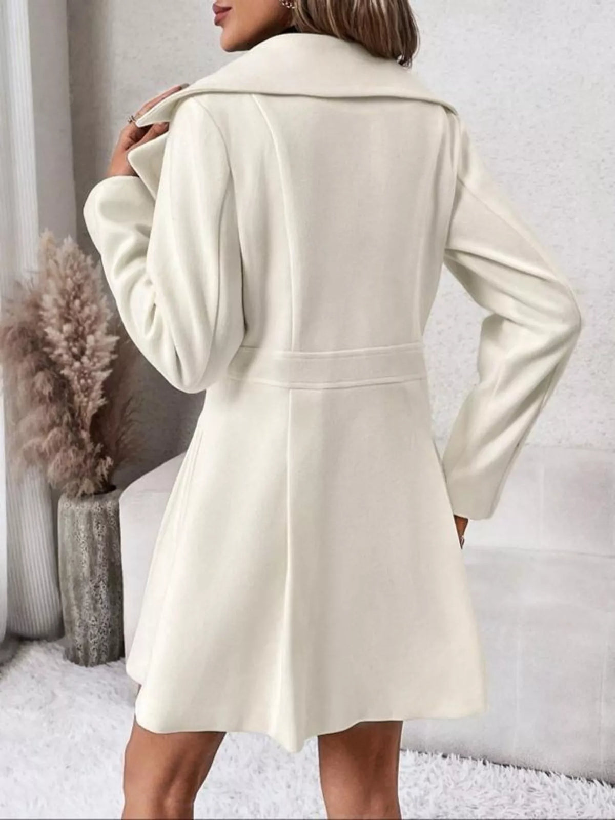 White double-breasted peplum coat, back view