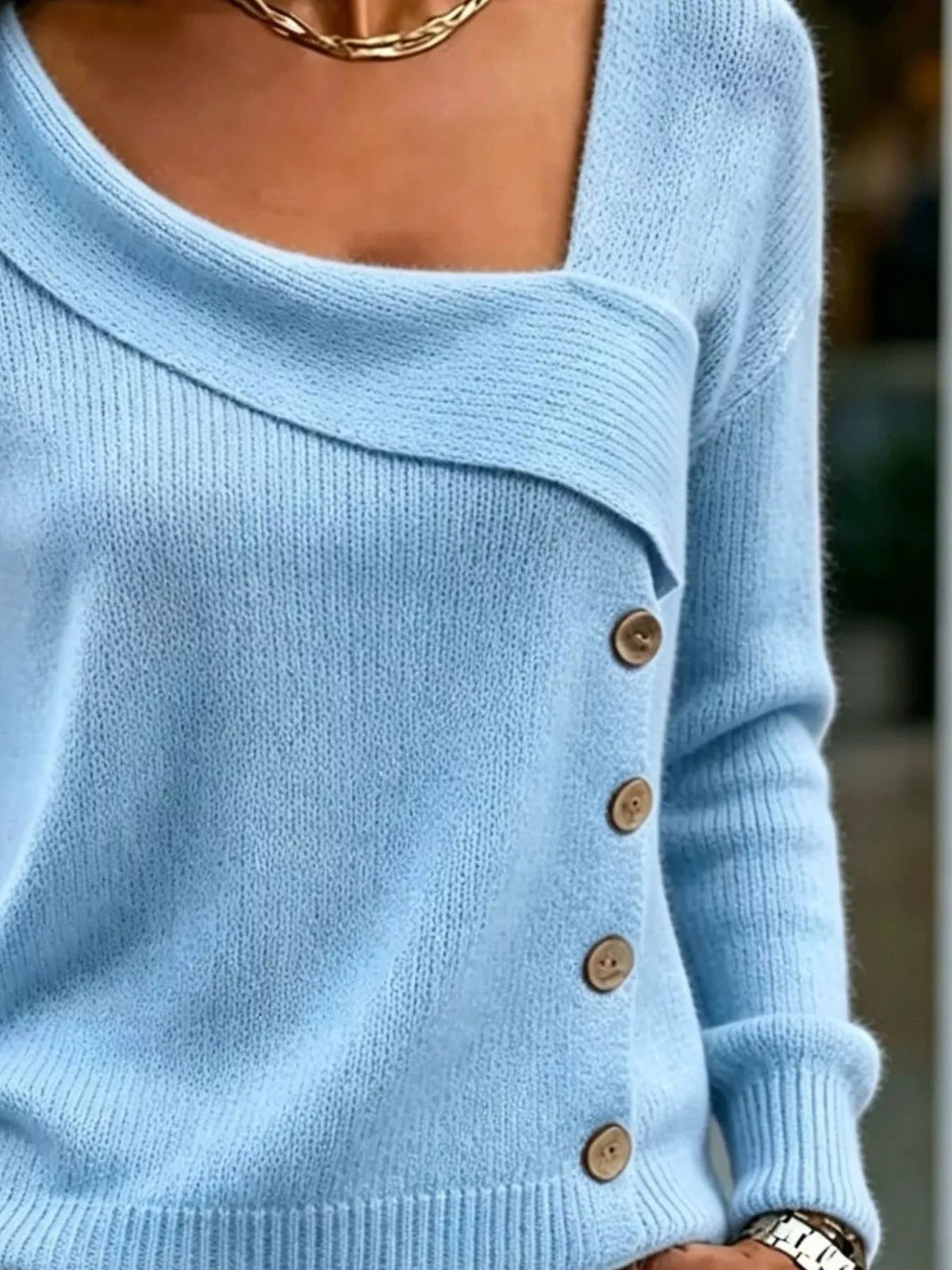 Women's Asymmetric Neckline Button-Decorated Sweater in light blue — neckline detail view