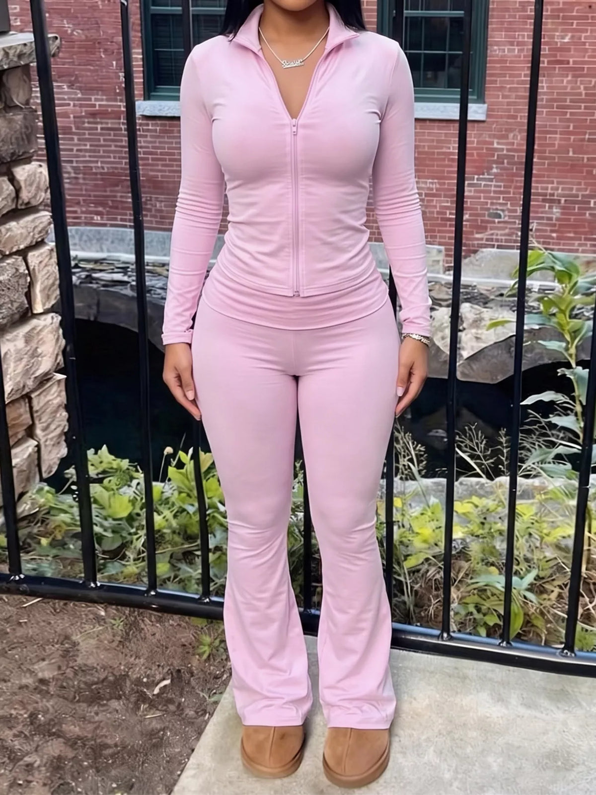 Pink hooded zip-up top and flared pants set