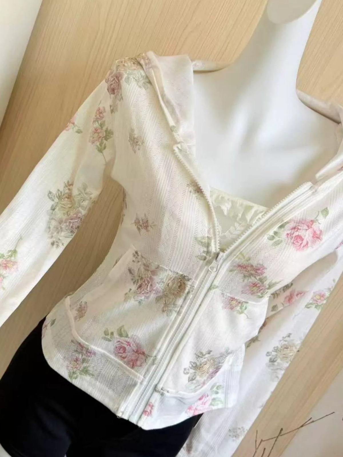 White floral print zip-up knit hoodie, detail view
