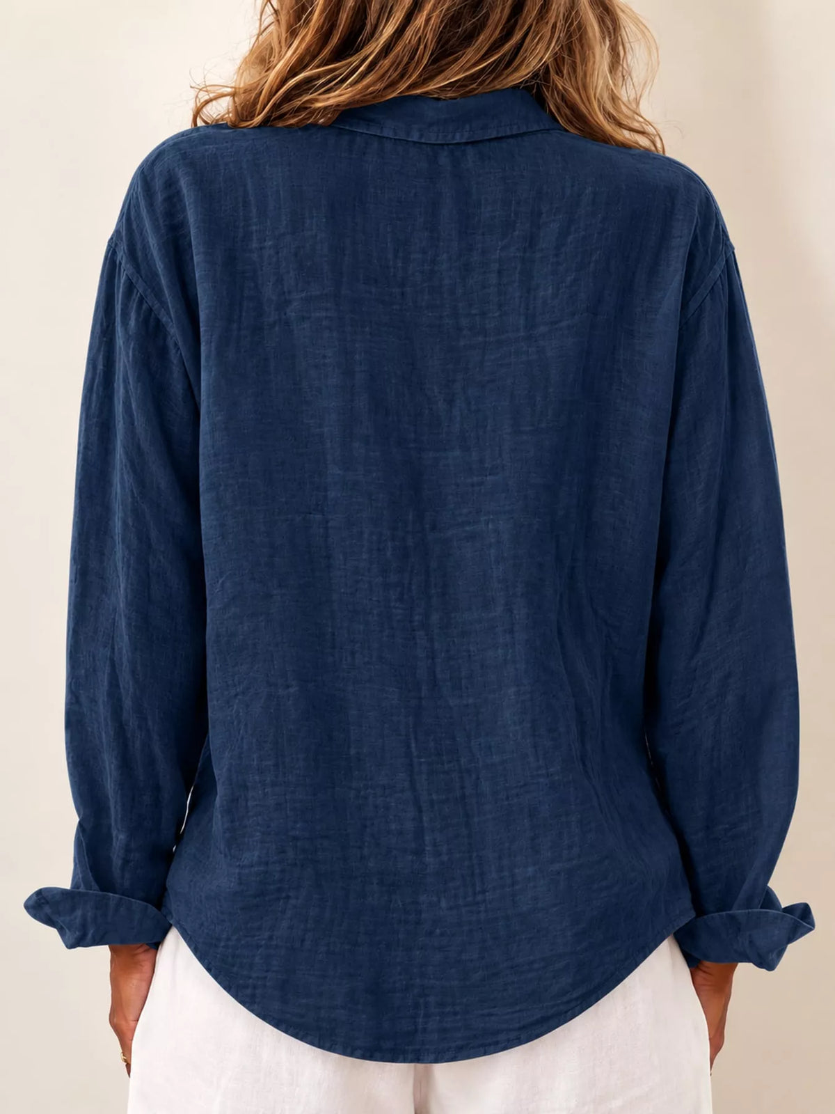 Blue asymmetric button-down long sleeve shirt, back view