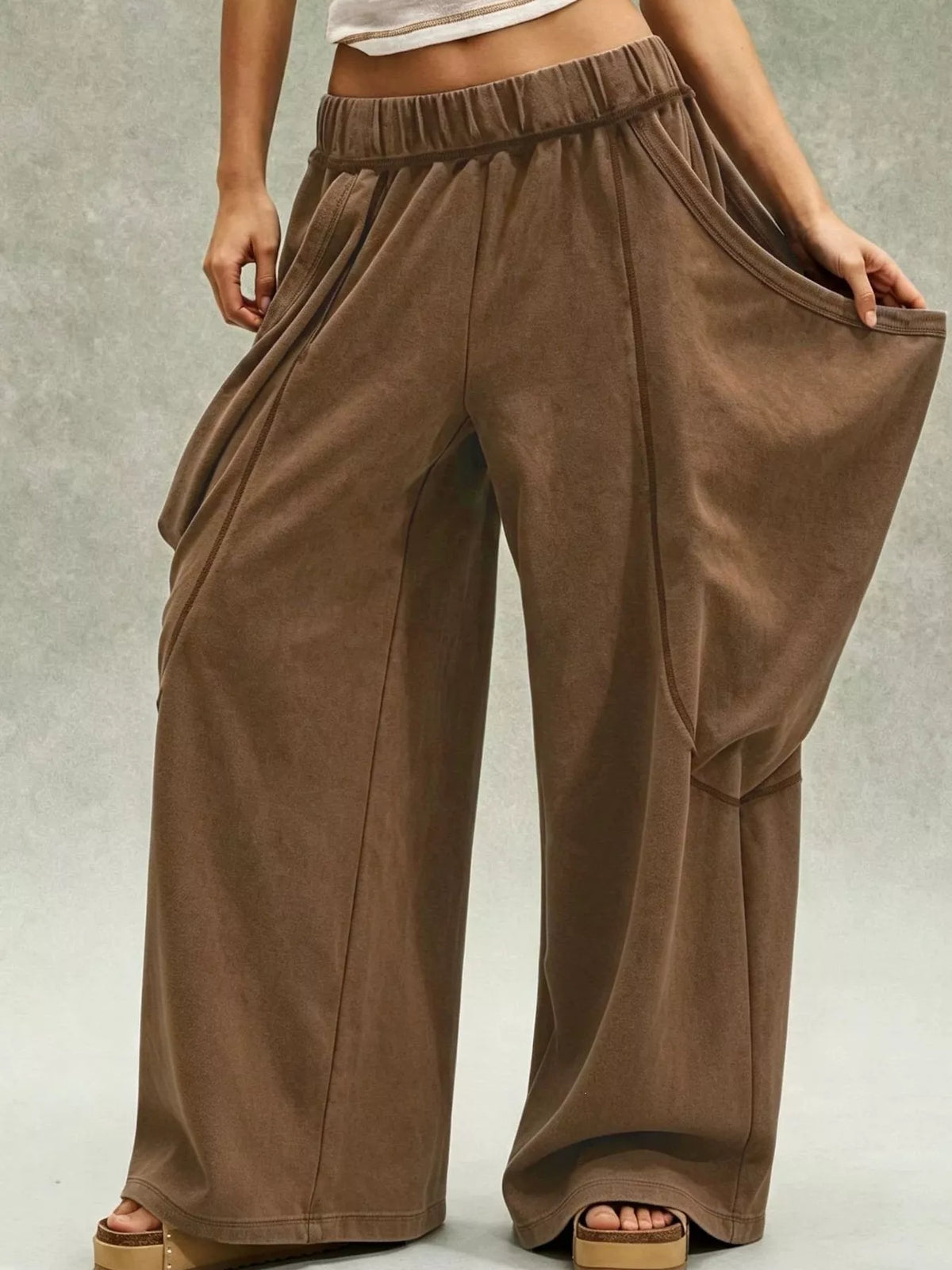 Brown wide-leg cargo pants, side pocket extended