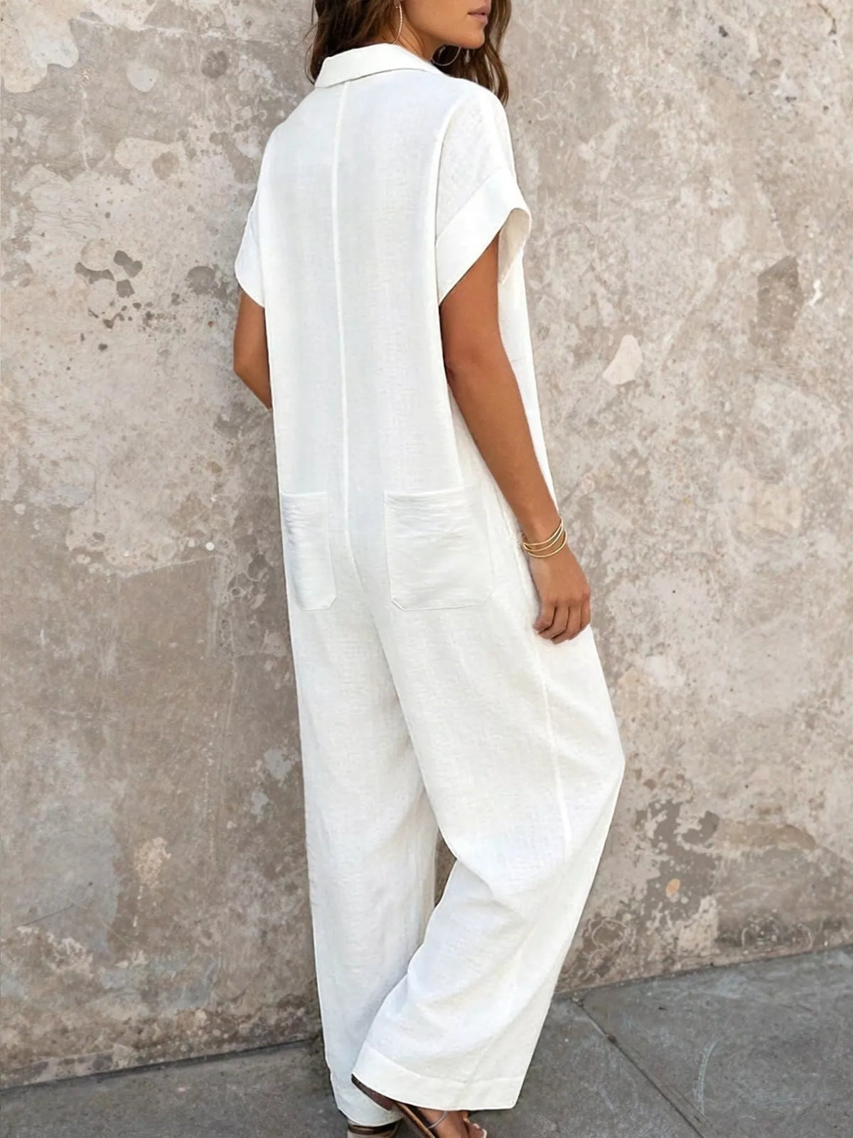 White button-front jumpsuit, back view