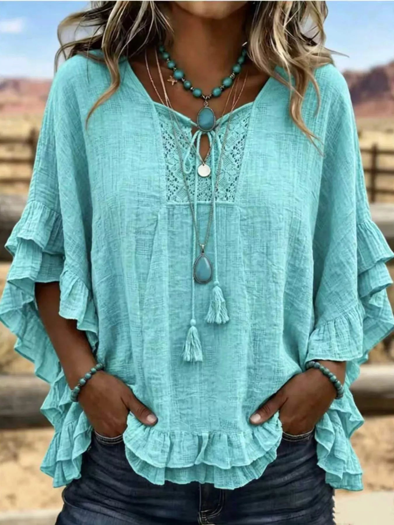 Trendsi Full Size Tassel Tie Neck Ruffled Hem Blouse Plus Size -