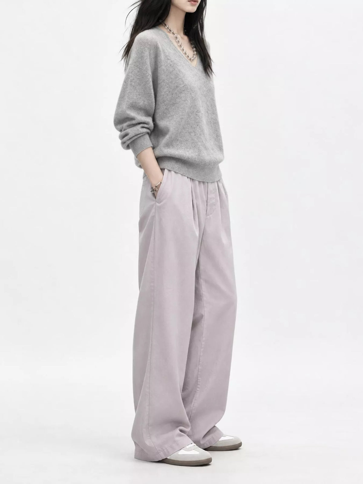 Light gray v-neck sweater, side view
