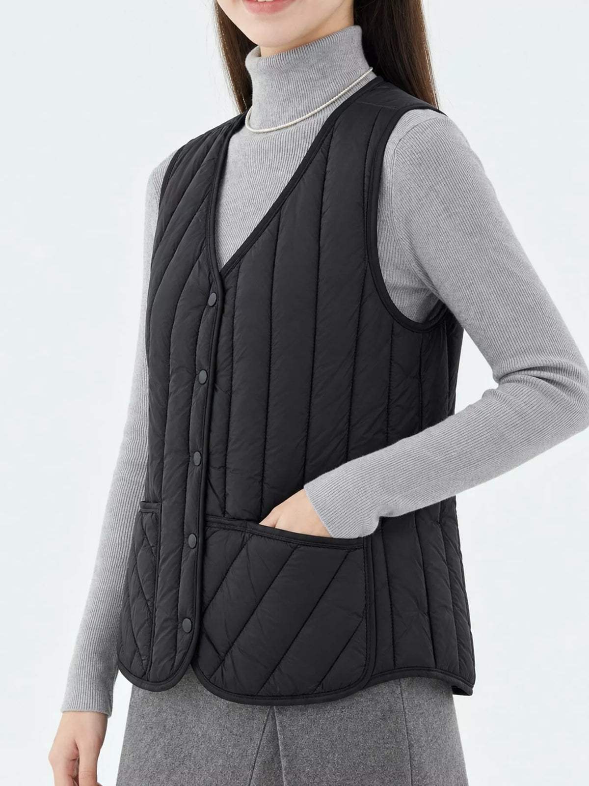 Quilted Button Up Vest in black, side view