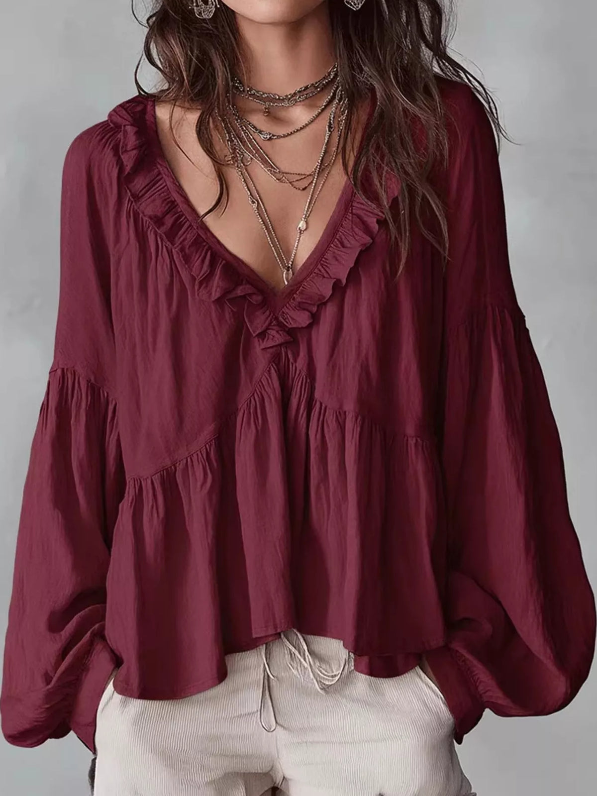 Burgundy ruffled v neck blouse, front view