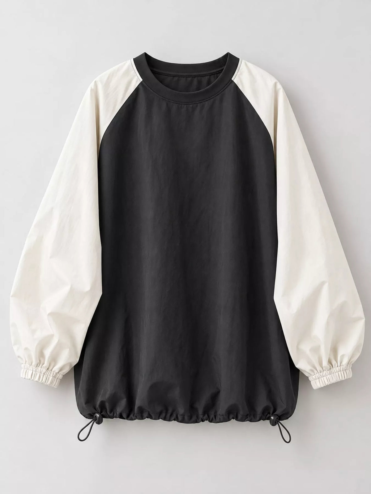 Colorblock sweatshirt, black and cream flat lay