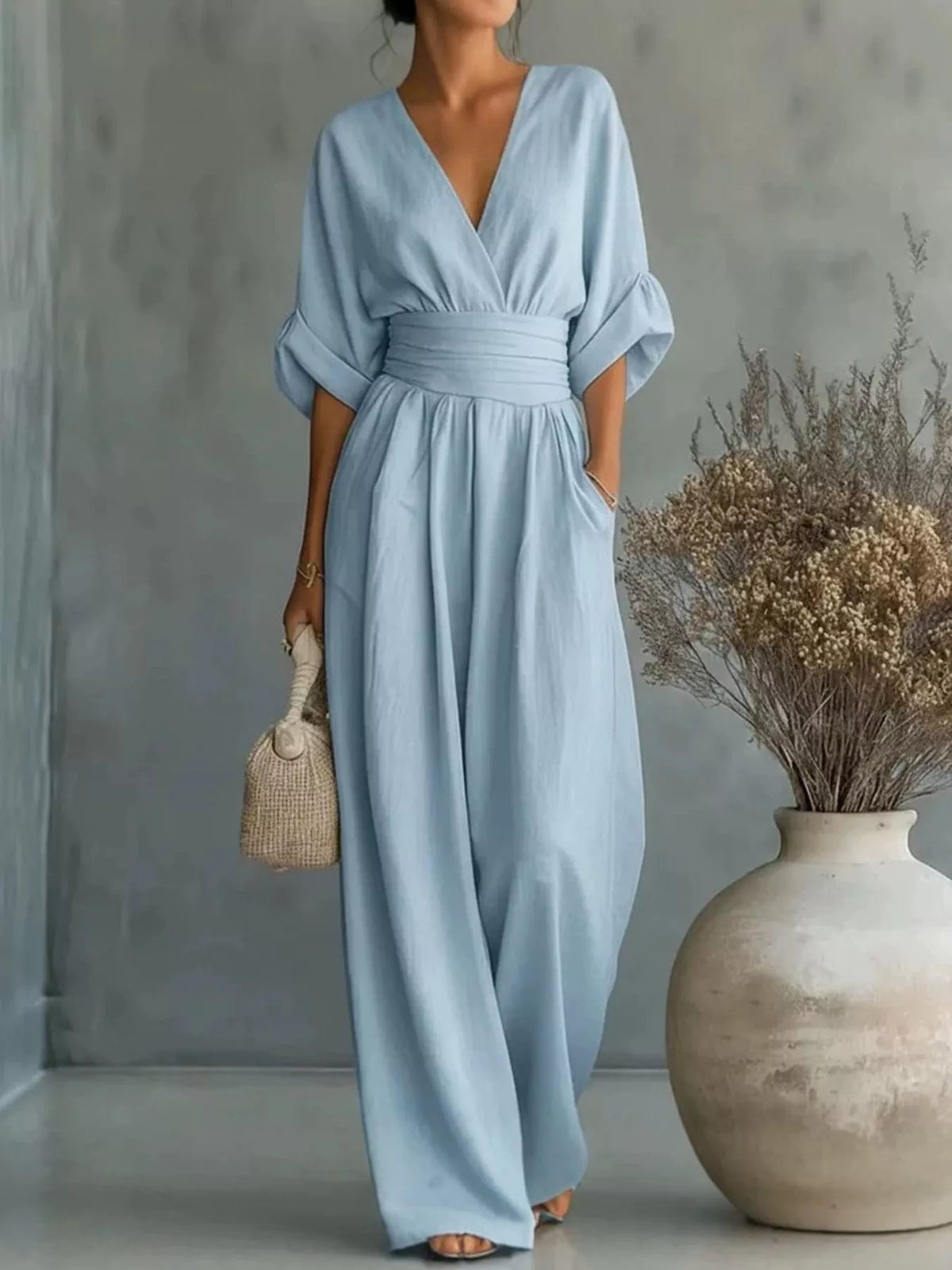 Light blue V-neck wide-leg jumpsuit, front view