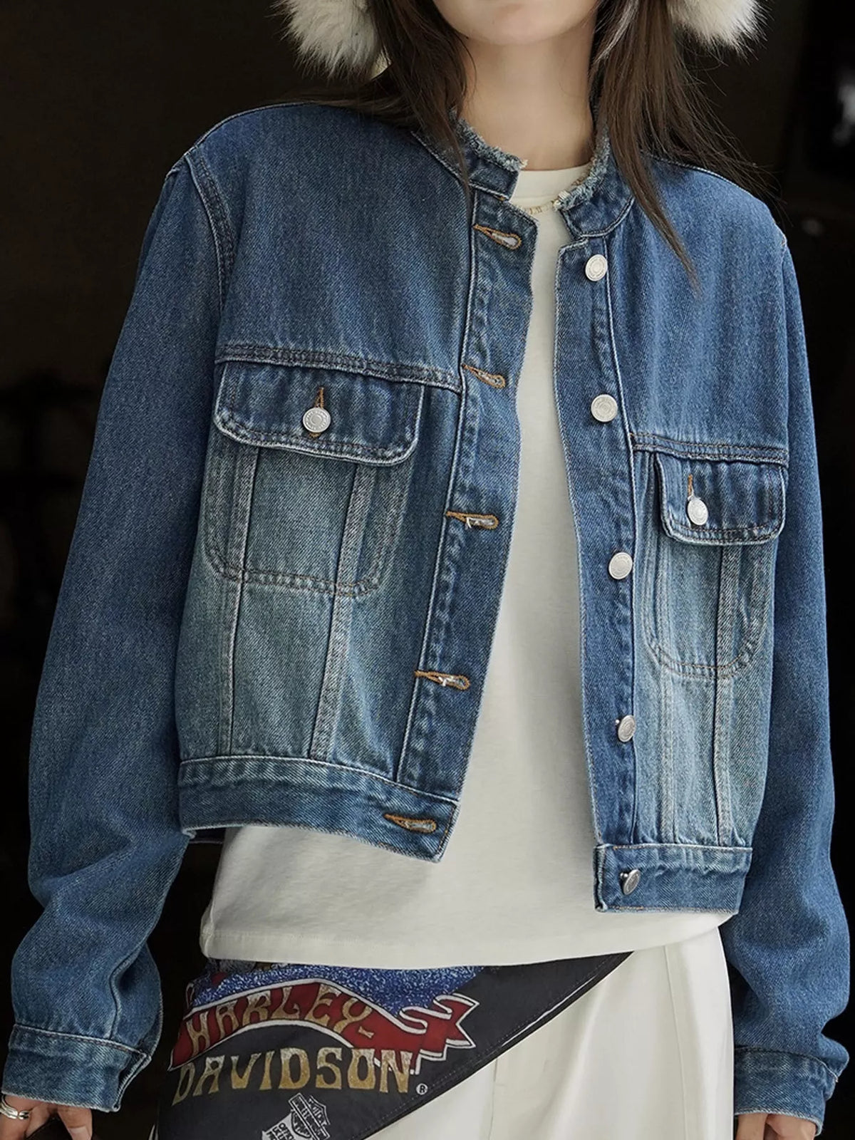 Blue button-up cropped denim jacket — front view