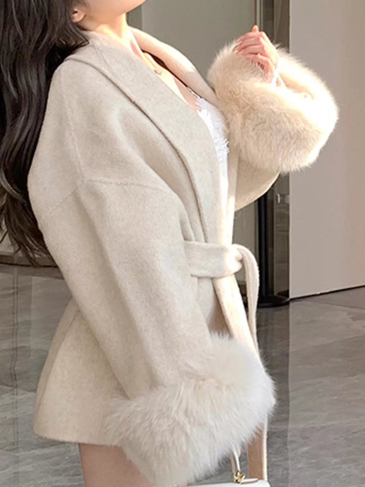 Cream tie-waist coat with faux fur cuffs — side view