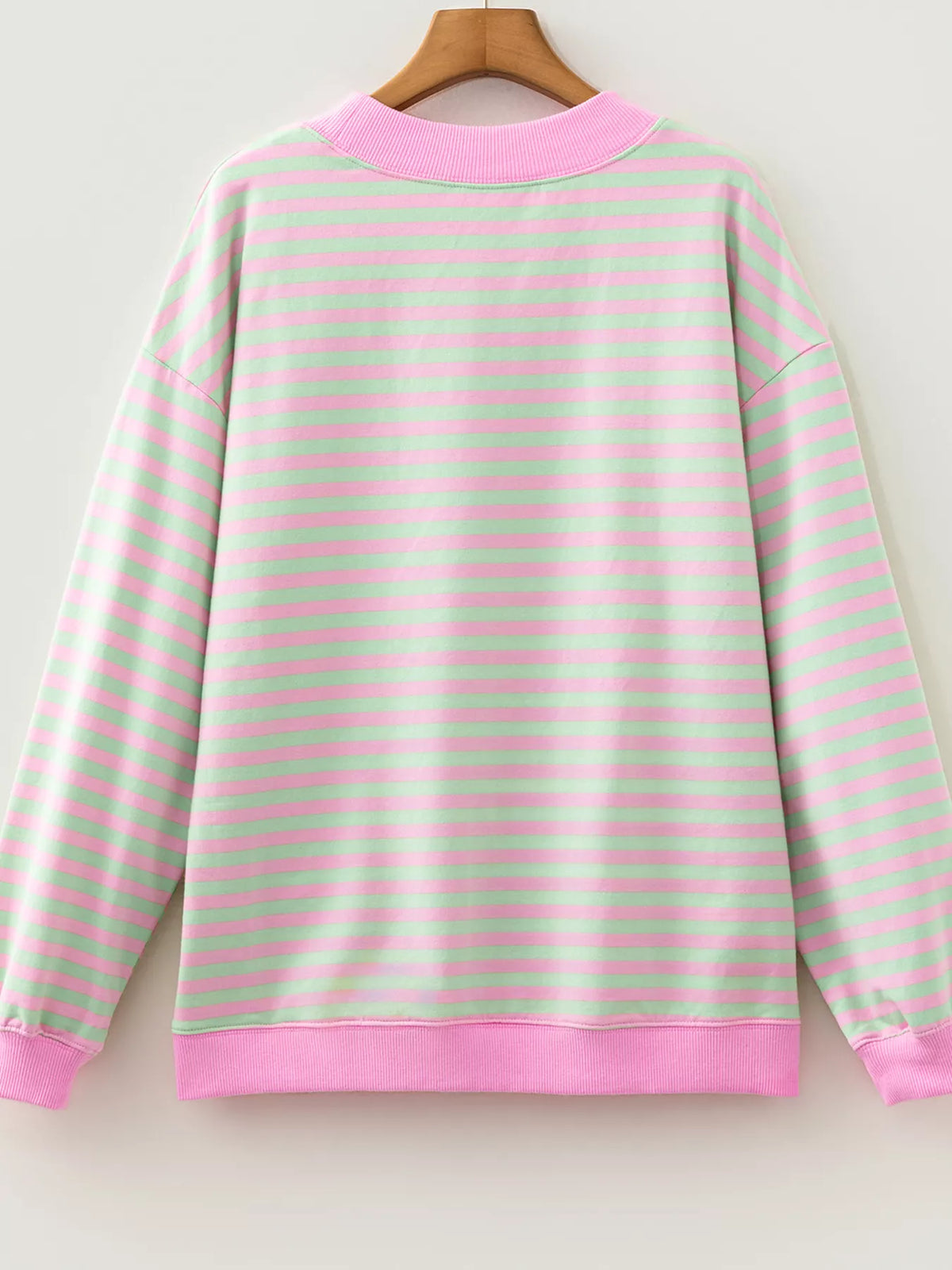 Striped Round Neck Long Sleeve Sweatshirt in pink and green, hanger back view