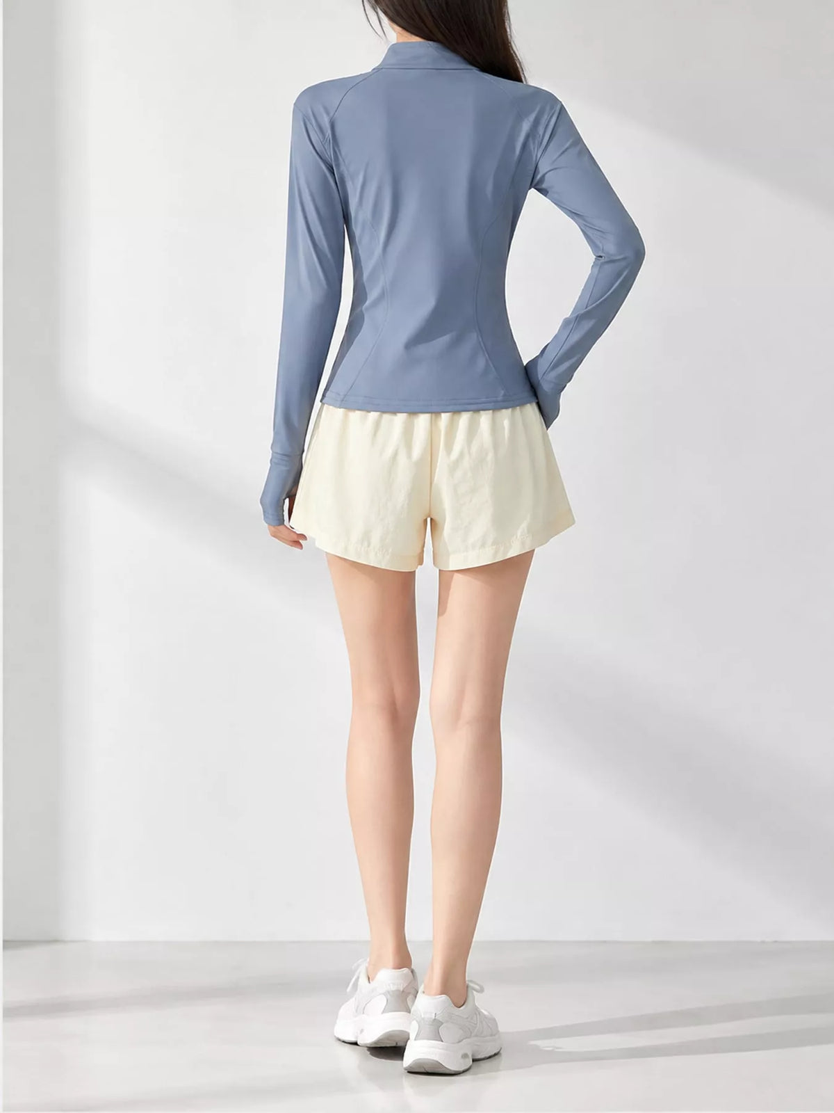 Blue quick-dry zip-up jacket, back view