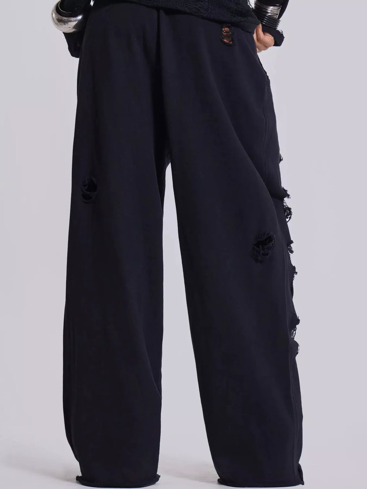 Black distressed high-waisted wide-leg sweatpants, back view