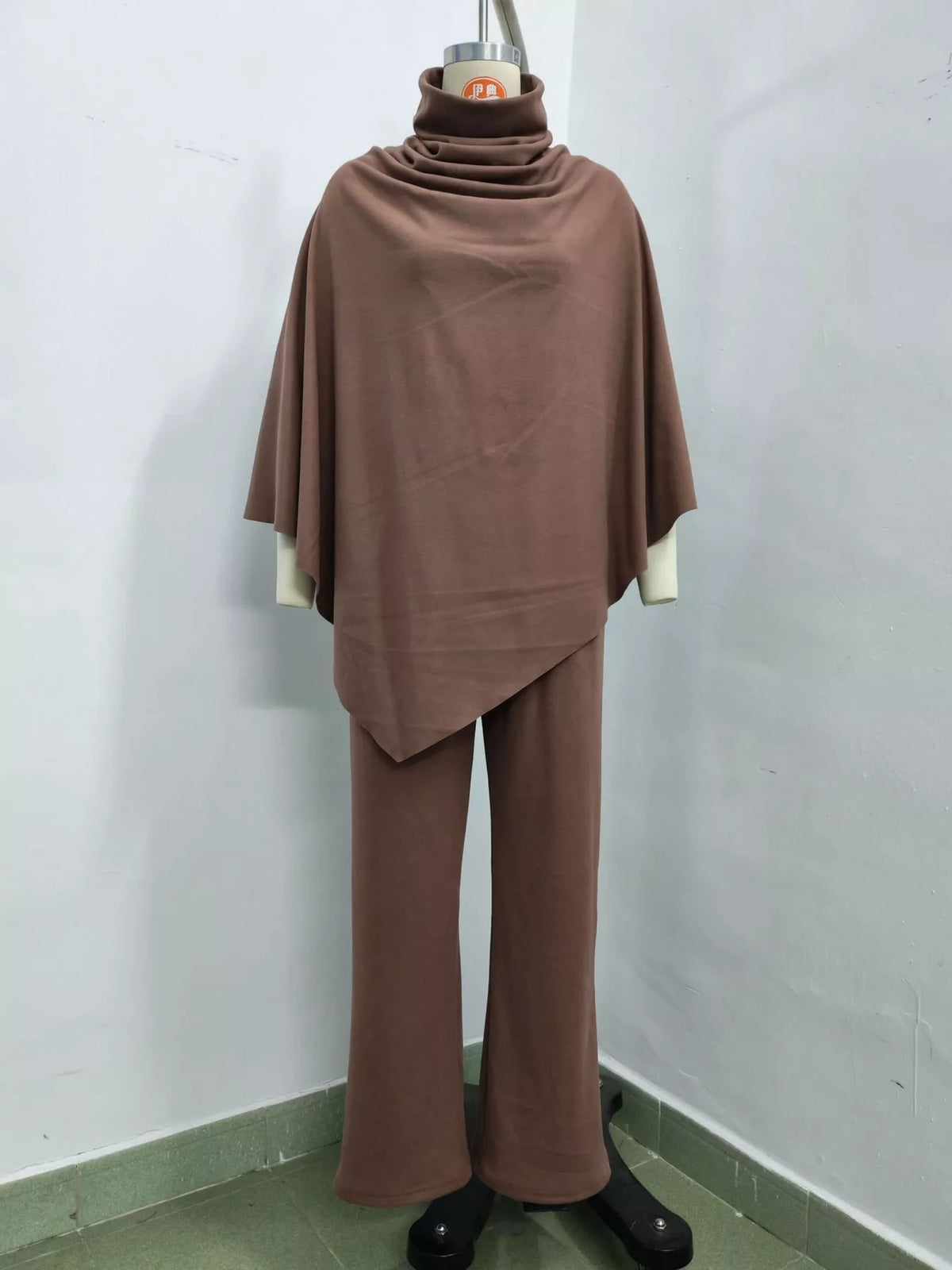 Poncho and pants set, brown mannequin front