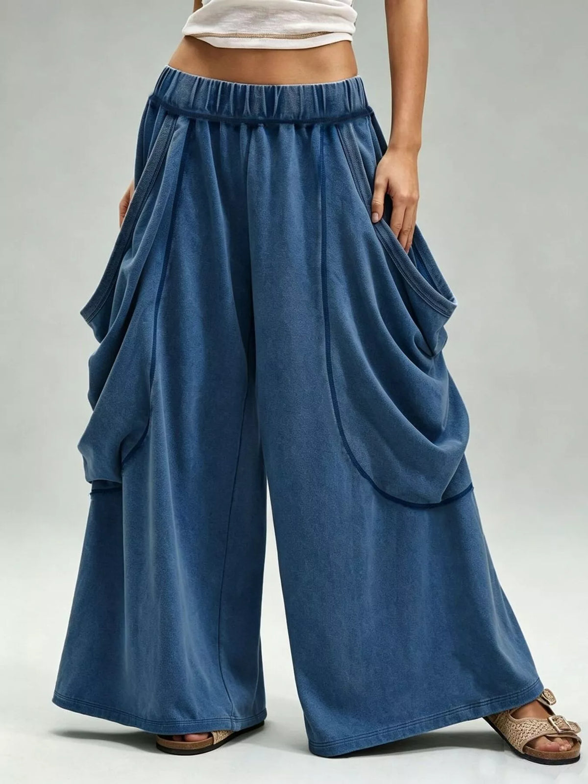 Blue wide-leg cargo pants, front view with legs apart